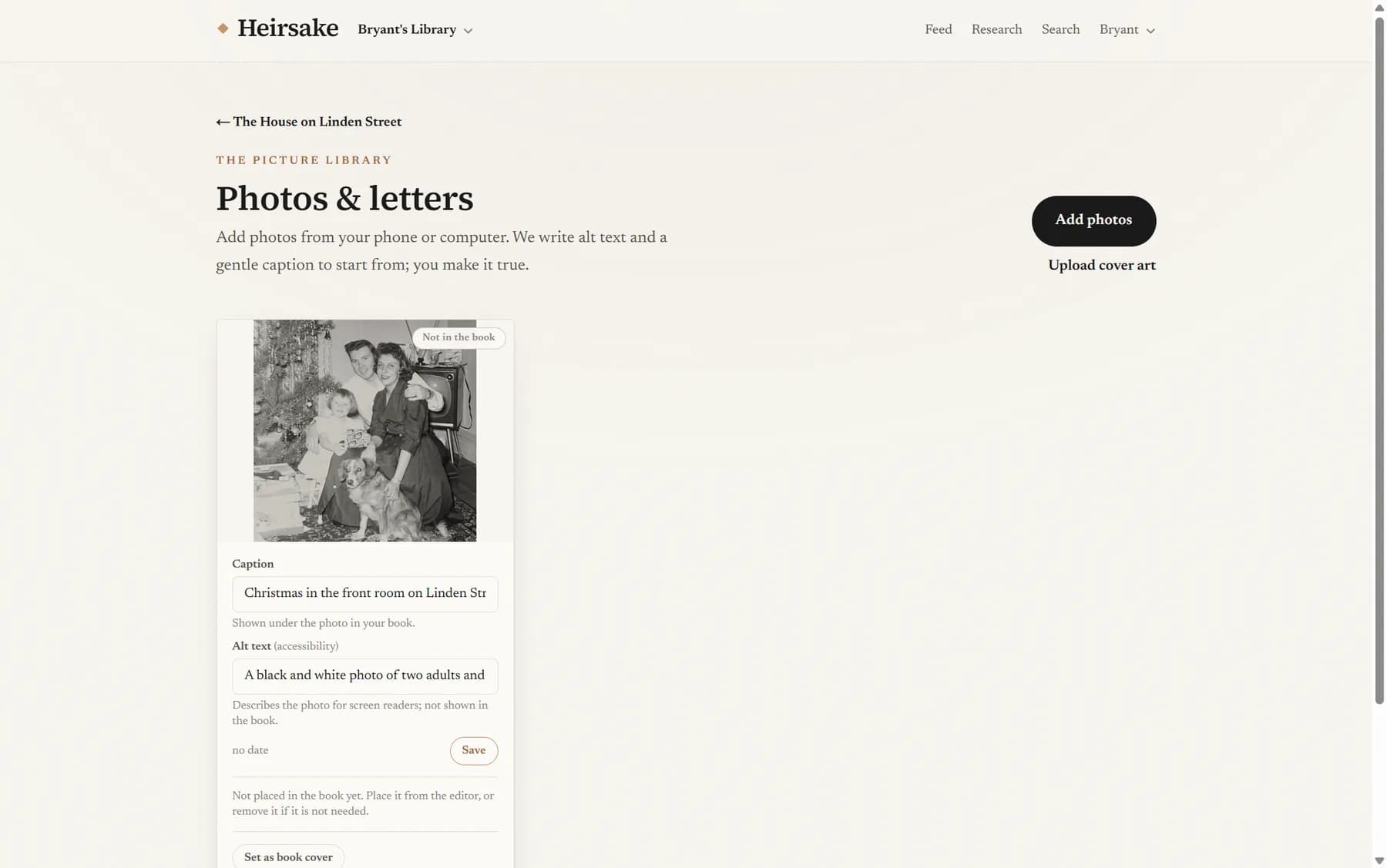 The photos screen showing an uploaded black and white family photograph with a caption and description ready for the family to refine.